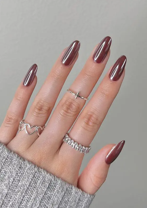 chocolate glazed donut nails of an almond shape are a cool idea for a fall or winter outfit