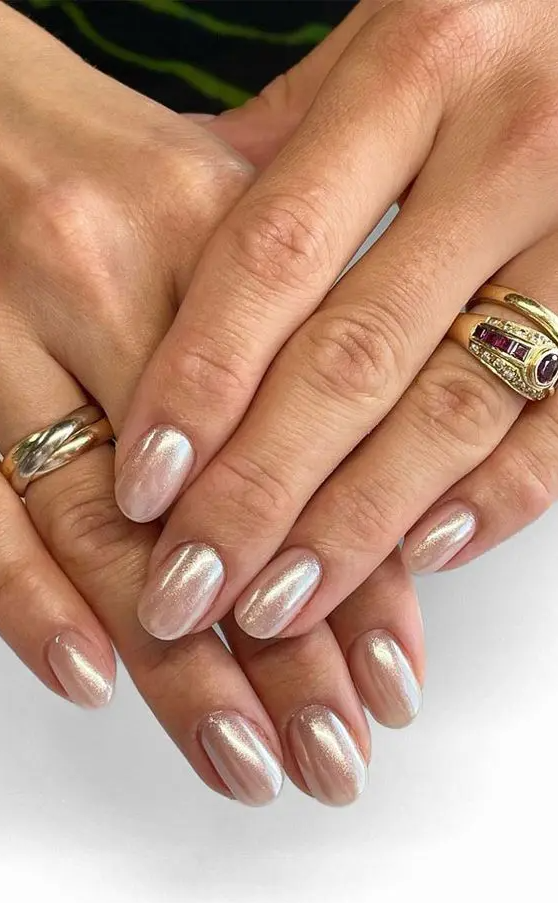 elegant pearly nails of a soft nude shade are amazing for a bride and after the wedding you will wear them with most of your looks