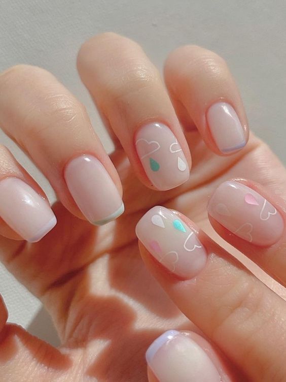 lovely and cute milky nails with French tips and clouds with raindrops are amazing and pretty