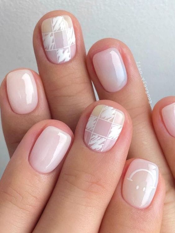 lovely milky nails with fun nail art, a smile and some checks are very cute, fun and lovely, if you want something special, this is it