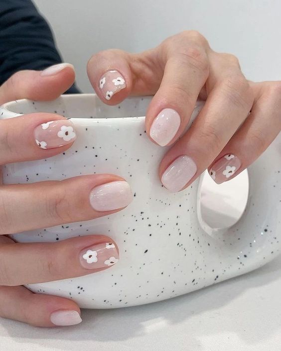 milky and nude nails with little flowers are a super cute and lovely idea for a spring or summer look