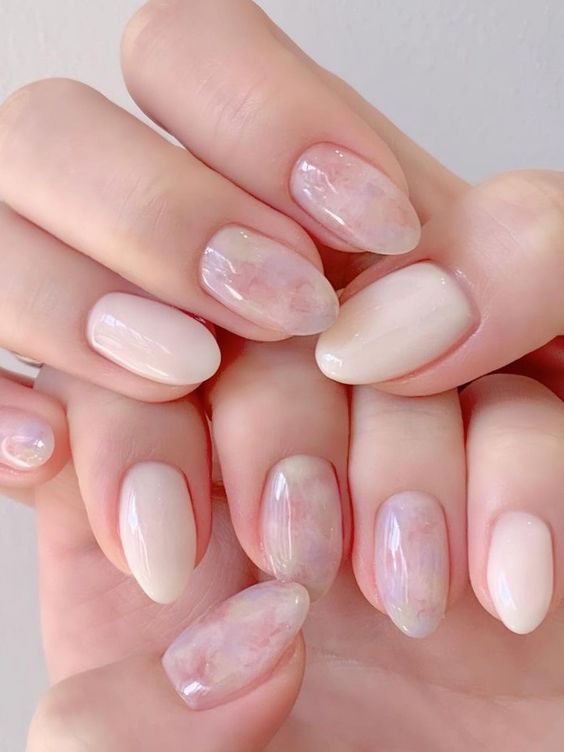 milky nails paired with blush watercolor ones are a dreamy and lovely idea for spring