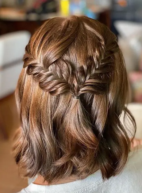 a beautiful medium half updo with a fishtail braid halo and waves down is a cool solution for many occasions