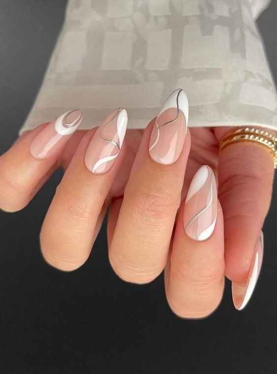a beautiful take on French nails, with white and silver swirls and white tips is a lovely idea