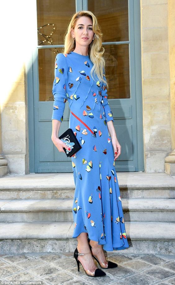 a blue printed maxi dress with an asymmetrical skirt, long sleeves, black shoes and a tiny bag for a bridal shower