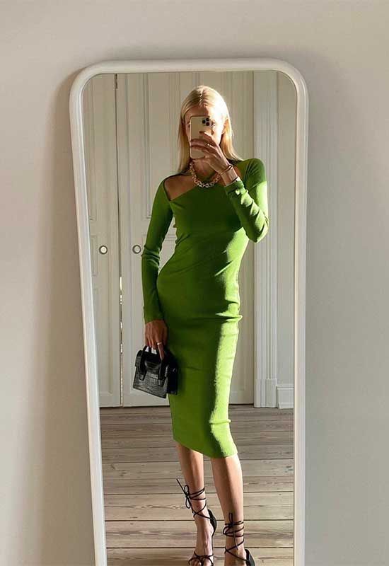 a bold green midi dress with long sleeves, black lace up shoes and a small bag plus a statement necklace