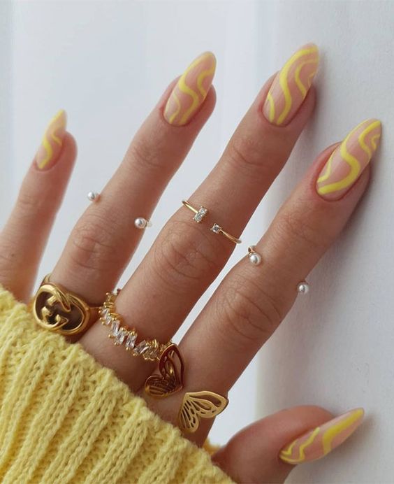a bold yellow swirl manicure is a lovely idea for spring or summer, rock bold colors and enjoy the looks