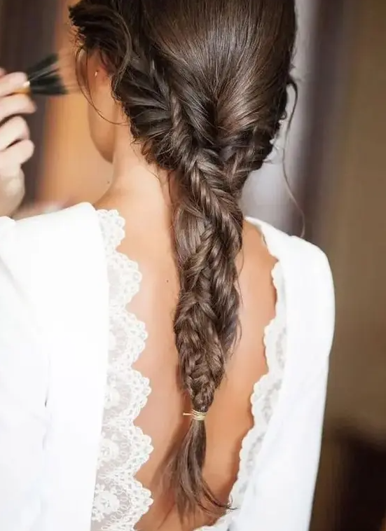 a braid made of two fishtail braids, which is a cool idea for any boho girl, and it can be worn to a boho wedding