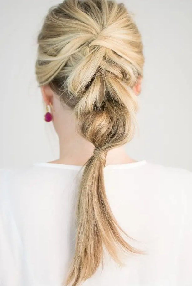 a braid with a bump on top is a chic idea for a holiday party and isn’t that difficult to make