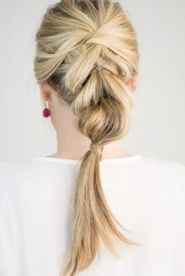 a braid with a bump on top is a chic idea for a modern bridal look and isn't that difficult to make