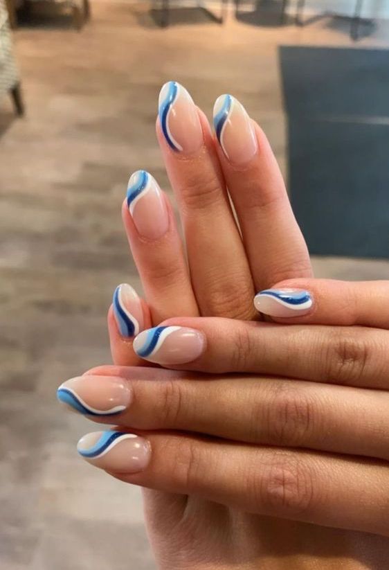 a bright and cool swirl French manicure done in blush, white, light blue and navy is adorable for spring and summer