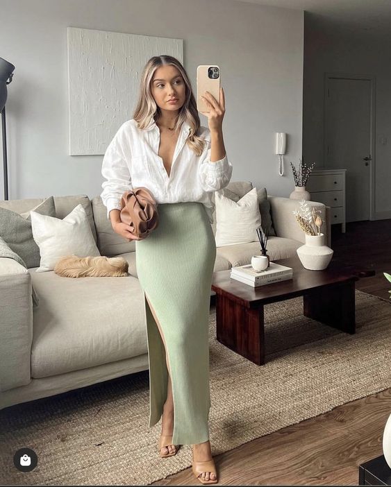 a chic spring look with a white linen button down, a pale green maxi skirt with a slit, nude mules and a brown bag