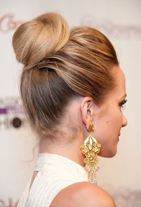 a classic ballerina top knot with a bump on top is a chic and classy hairstyle to rock at a wedding