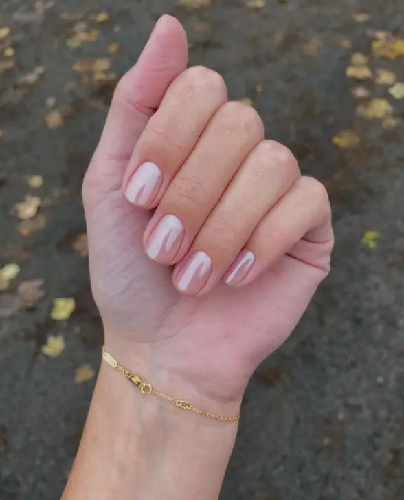 a classy chrome nude manicure on short nails of a square oval shape is amazing for a modern bride