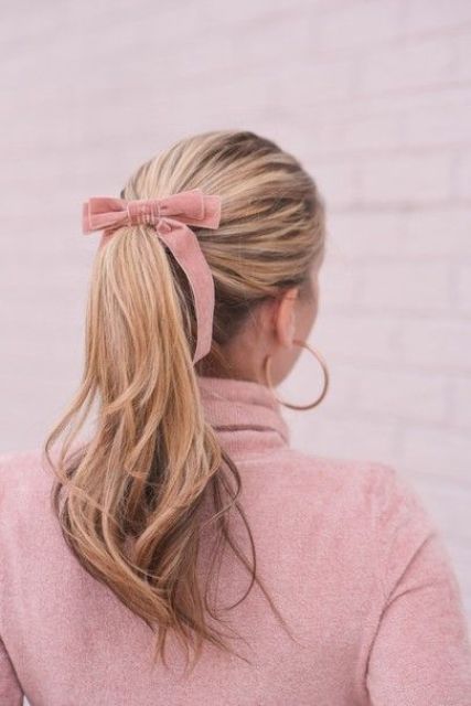 a classy high ponytail with a volumetric top and waves plus a pink velvet bow are a timeless idea for every party