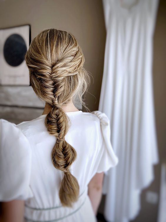 a classy tight bubble braid is a cool idea for a boho, modern or many other bridal looks
