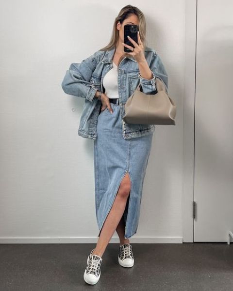 a comfy double denim look with a white top, a blue denim maxi skirt, a blue denim jacket, sneakers and a grey bag