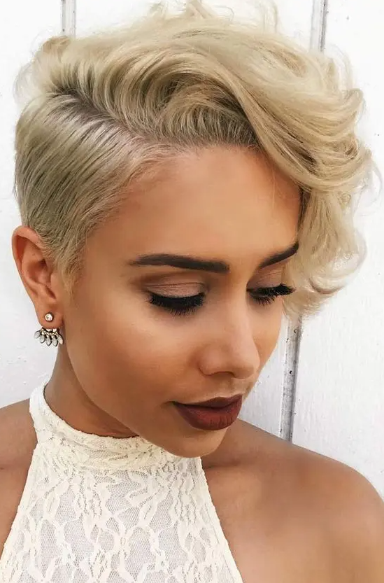 A creamy blonde long wavy pixie with side parting is a bold and catchy idea, and such styling is very eye catching