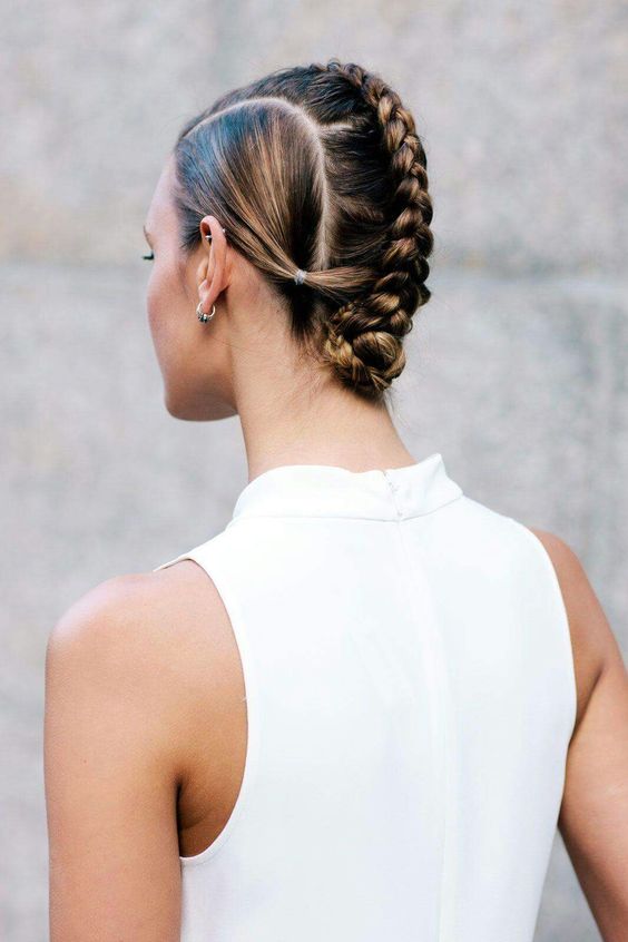 a creative updo with a braid fixed on top the head and a sleek top is a unique idea if you are tired of all the same hairstyles