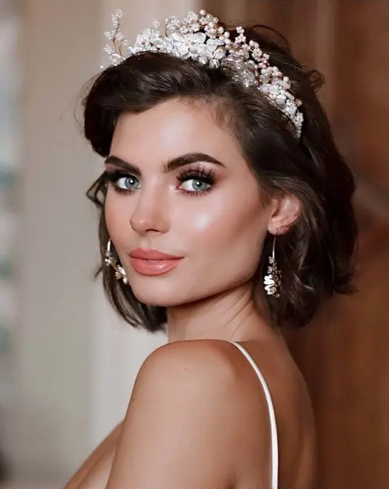 a fab shiny dark brown bob with side parting and a heavy pearl and rhinestone tiara are a gorgeous combo for a wedding