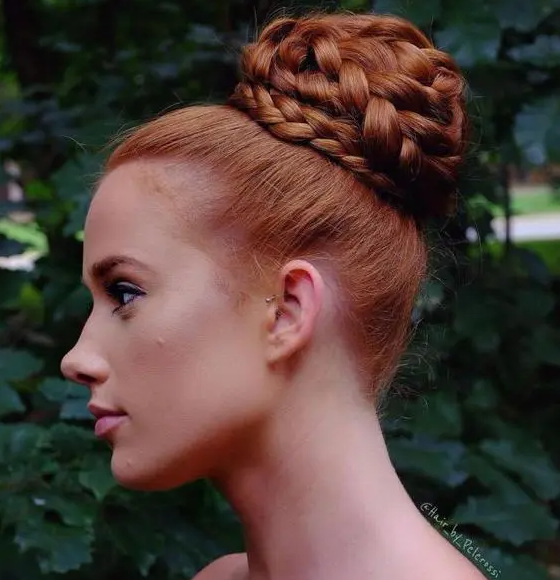 a fully braided top knot is a cool take on a traditional top knot and braids are very trendy