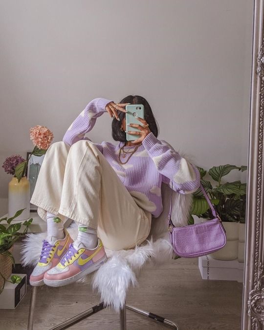 a fun Easter look with a lilac cloud jumper, white jeans, pastel sneakers, a lilac baguette bag and necklaces