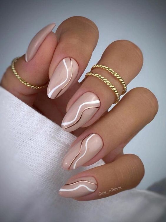 a glam and chic swirl manicure done in blush, copper and white is a cool and catchy idea for spring and not only