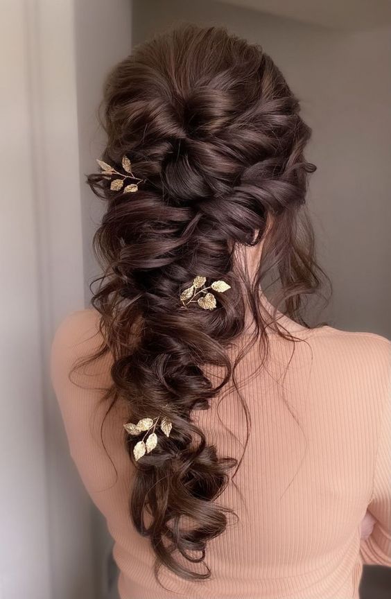 a glam loose twisted braid plus gold leaves is a fantastic idea for a wedding