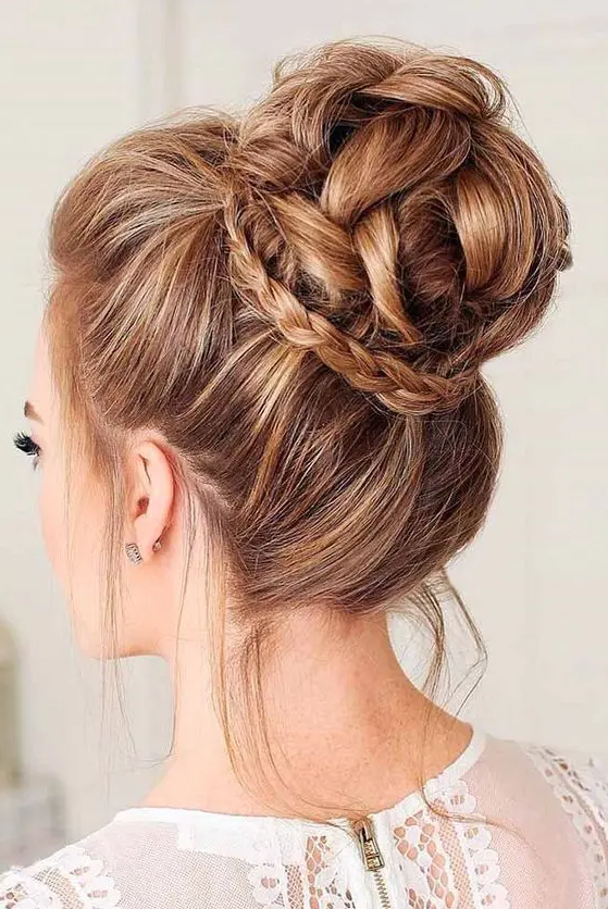 a gorgeous braided top knot with a little braid for detailing and some locks down is a bold idea
