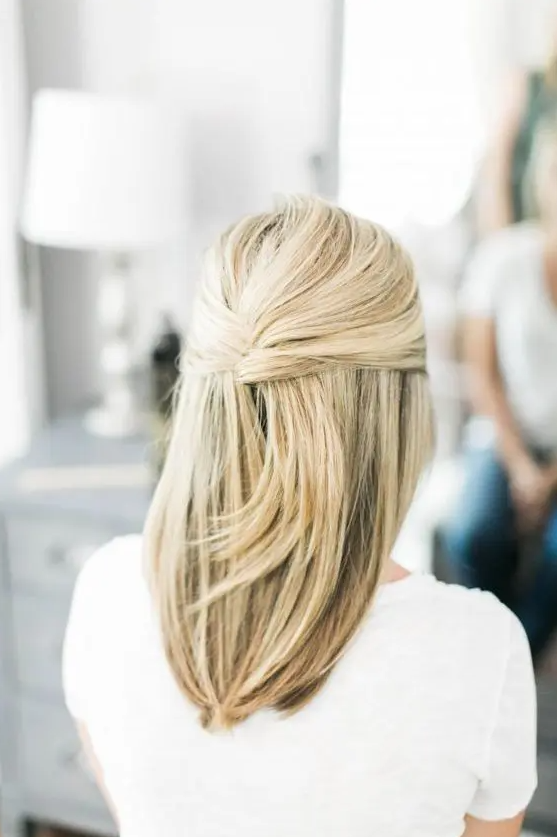 a half French twist updo with straight hair down is an elegant idea for super straight hair