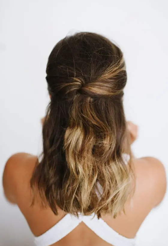 a half updo with a bump on top, twists and waves down is a cool idea for medium length hair