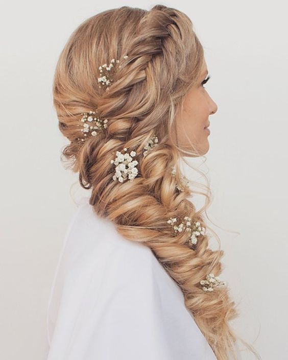 a large twisted side braid with a braided top and baby’s breath is a gorgeous idea for a wedding