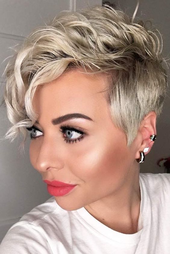 a long blonde pixie cut styled with waves is a cool and catchy idea for a wedding