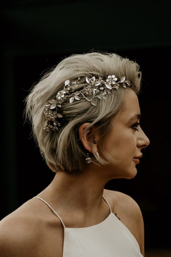 a long blonde pixie to bob haircut accented wih a gorgeous floral hair piece is a fantastic solution