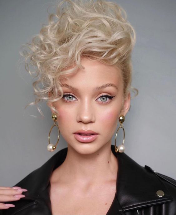 a long platinum blonde pixie cut with curls and extra volume is amazing for a bridal look