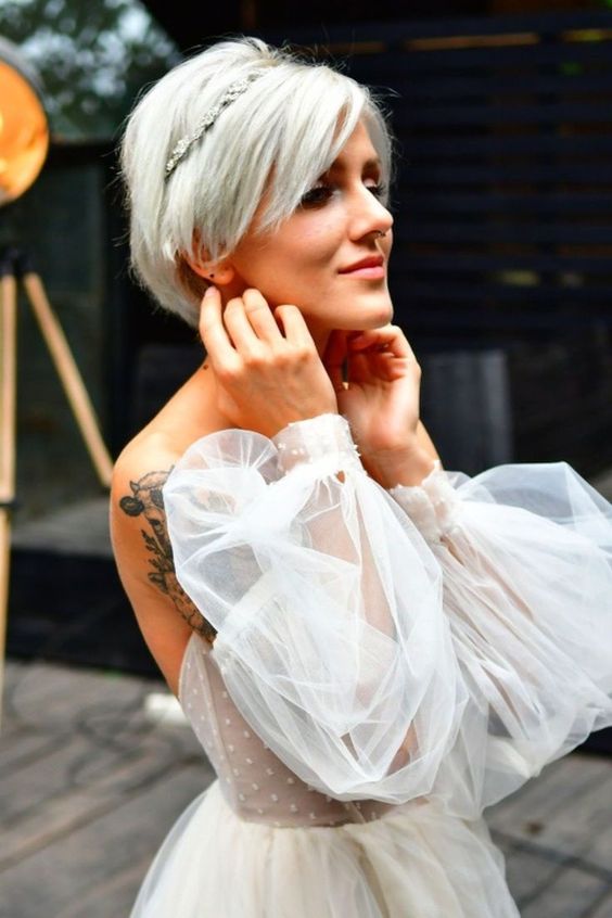 a long platinum blonde pixie with a rhinestone headband are an adorable combo for a wedding