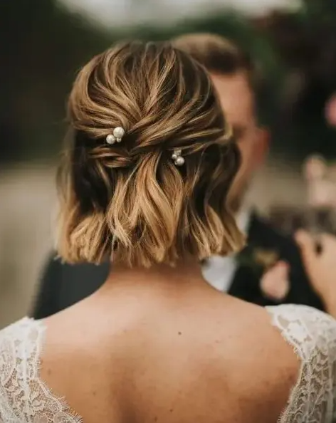 a lovely half updo on shirt hair, with some twists and pretty pearl hairpins is a very cool and delicate idea