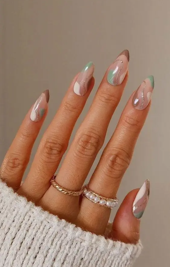 a lovely swirl manicure in taupe, green, white and silver glitter is amazing for fall, it looks very trendy