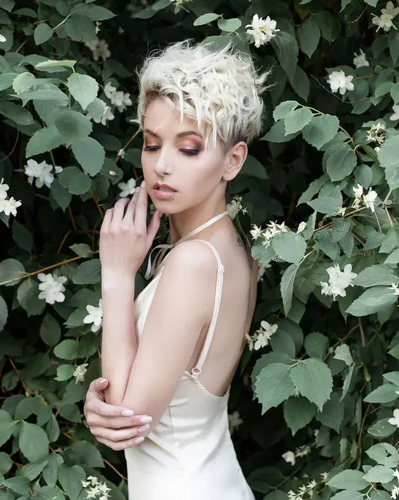 a messy and shaggy volumetric long pixie haircut is a cool solution for a modern or minimalist bridal look