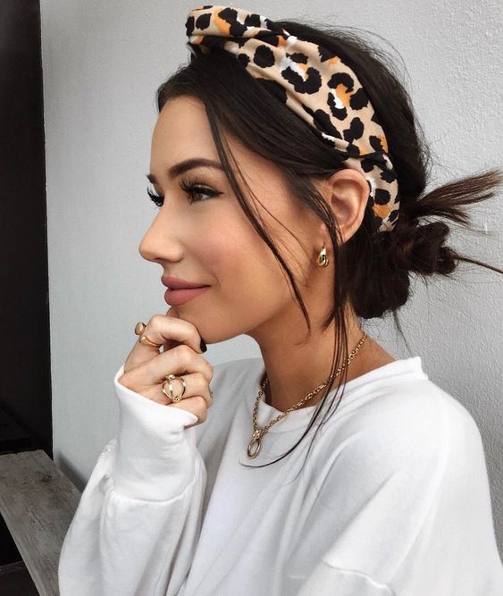 a messy low bun with a messy top, hair down and a bold leopard print headband are a lovely and eye-catchy solution