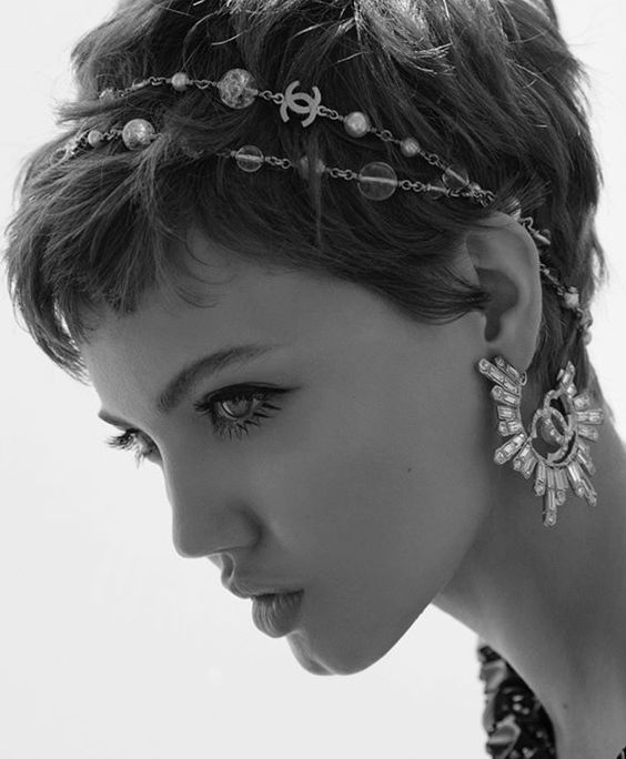 a messy textural pixie haircut with an embellished and bead hair vine plus statement earrings