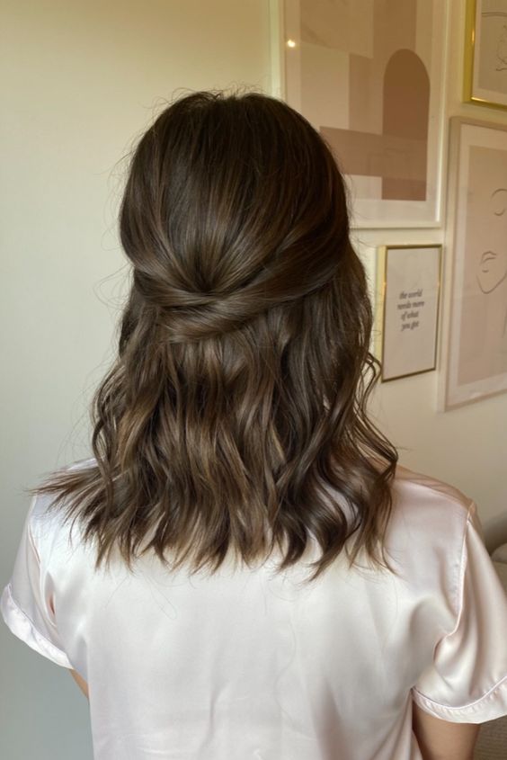 a more casual wedding half updo with a sleek top, twists and waves down will work for a casual wedding
