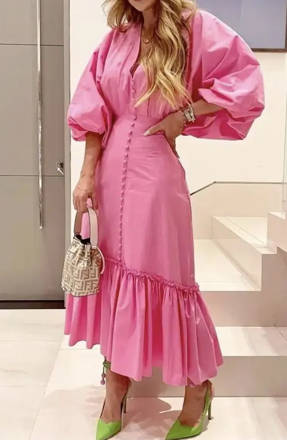 a pink button up maxi dress with puff sleeves and ruffles, a printed mini bag and green slingbacks for spring wedding