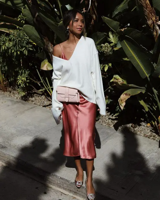 a pink slip midi dress, a white pullover on top, blush buckle shoes and a small blush bag for a spring to summer look