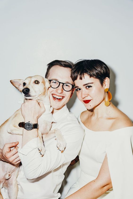 a short brunette pixie haircut with bangs is a cool and catchy idea for a wedding