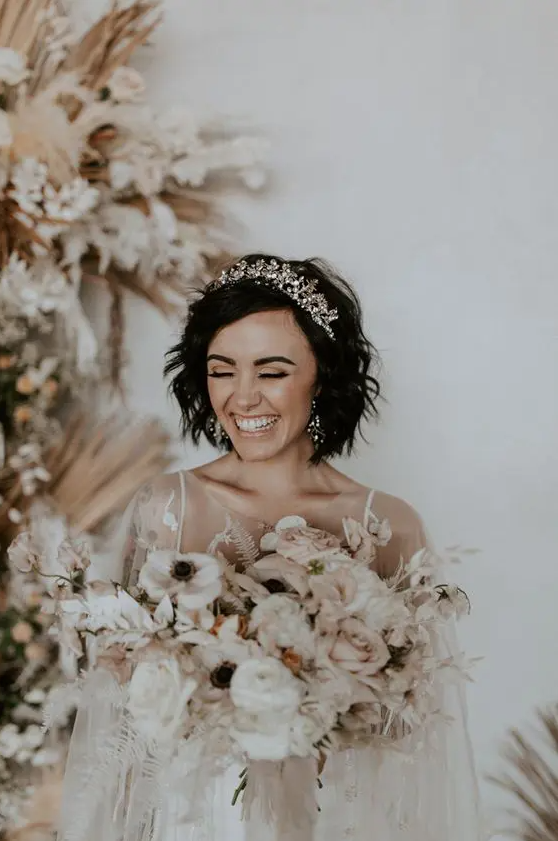 a textured feathered black bob with a gorgeous rhinestone tiara is a fantastic look for a wedding, it’s amazing