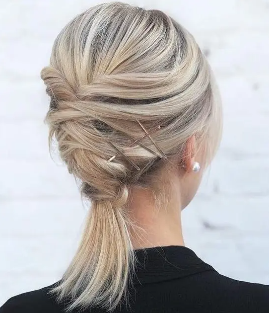A twisted updo with a ponytail and a bump on top plus some hairpins is a creative for medium length hair