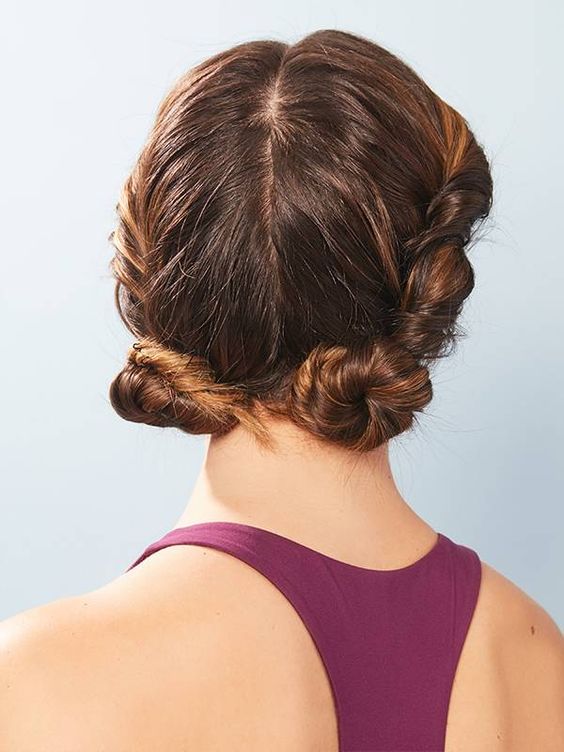 a twists paired with low buns are a super cool and cute gym hairstyle you may try on medium and long hair