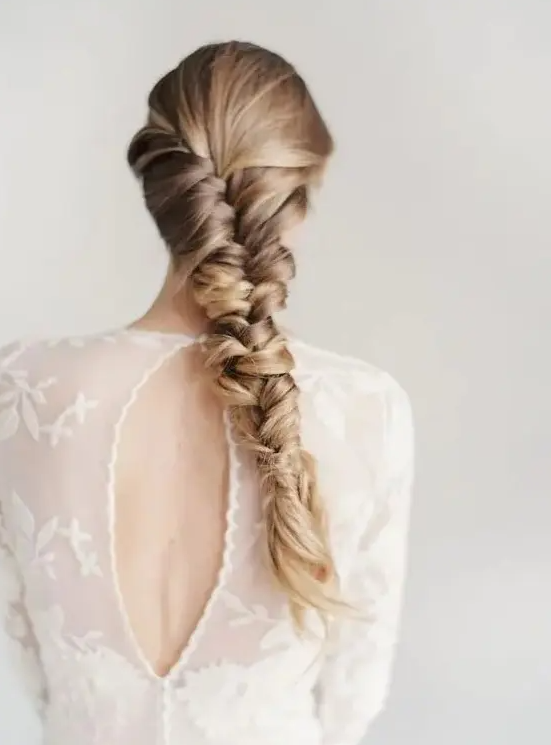 a very sleek and thick braid for long hair with highlights to create a texture is a cool idea for many bridal styles and outfits