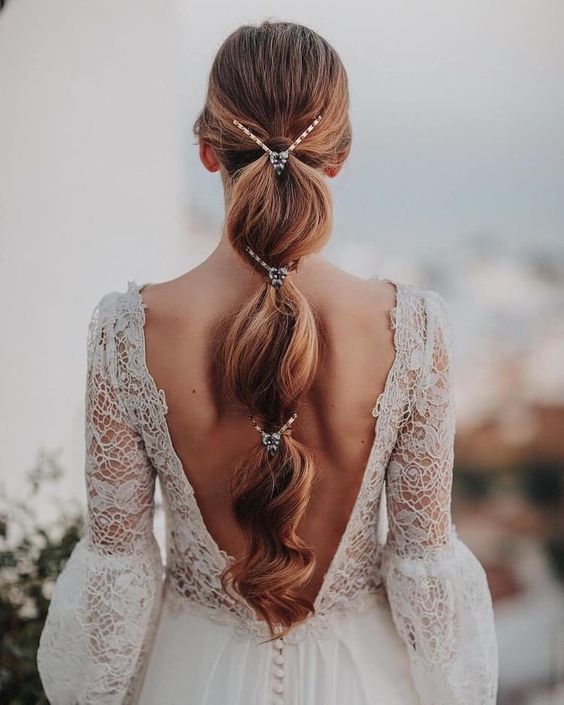 an elegant bubble braid with some embellishments is a cool and catchy idea for a wedding